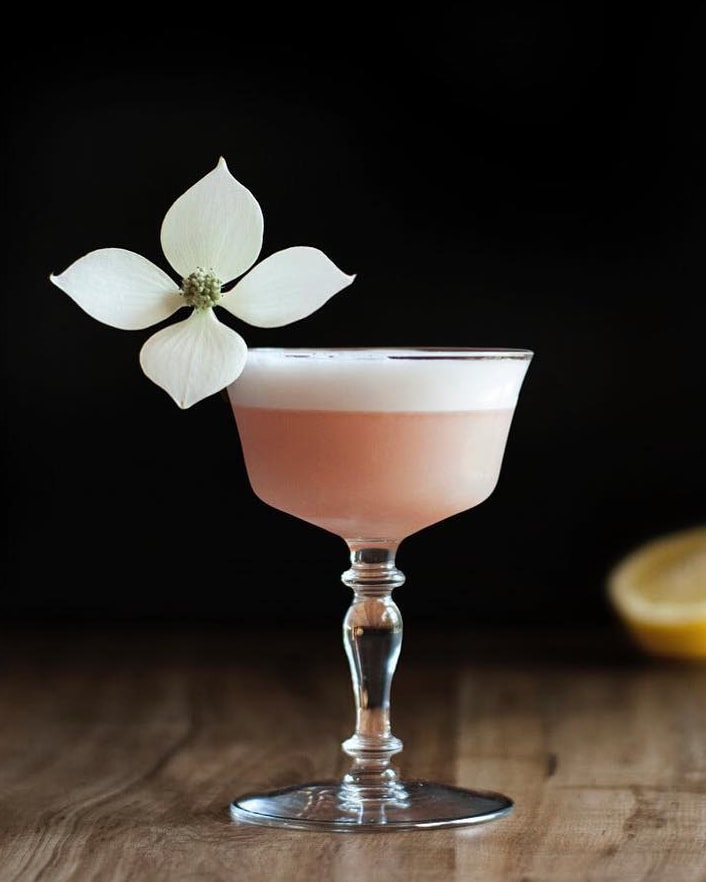 pink-lady-gin-cocktail-with-kousa-blossom-garnish