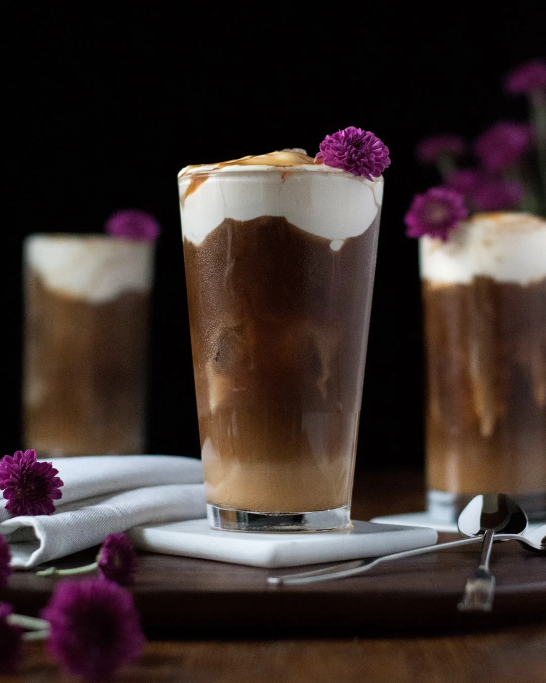 iced coffee with cheese cream floating on top.