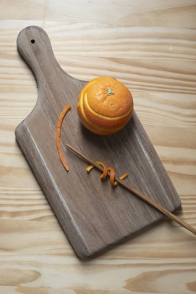 an orange twist on a chopstick