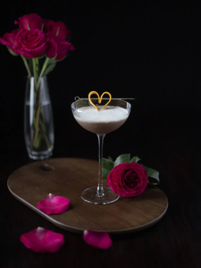chocolate cocktail with a heart-shaped orange peel garnish