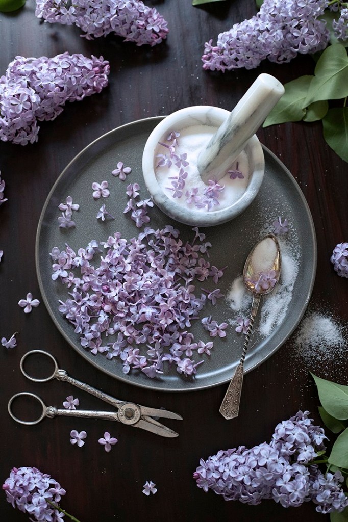 purple lilac blossoms and a mortar and pestle