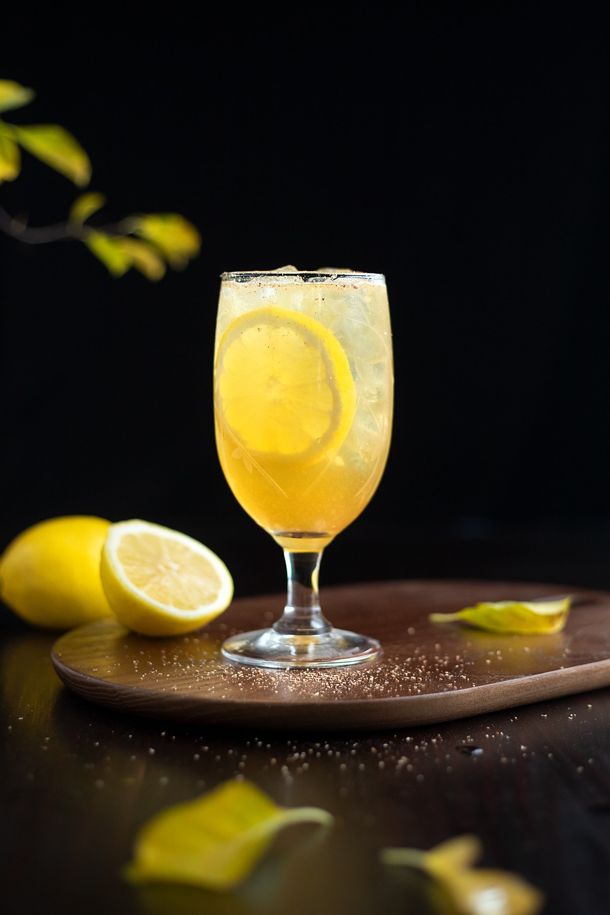glass of punch with lemon wheels