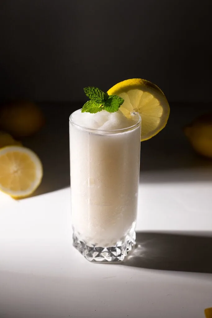 top down view of frozen whipped lemonade in a tall glass.