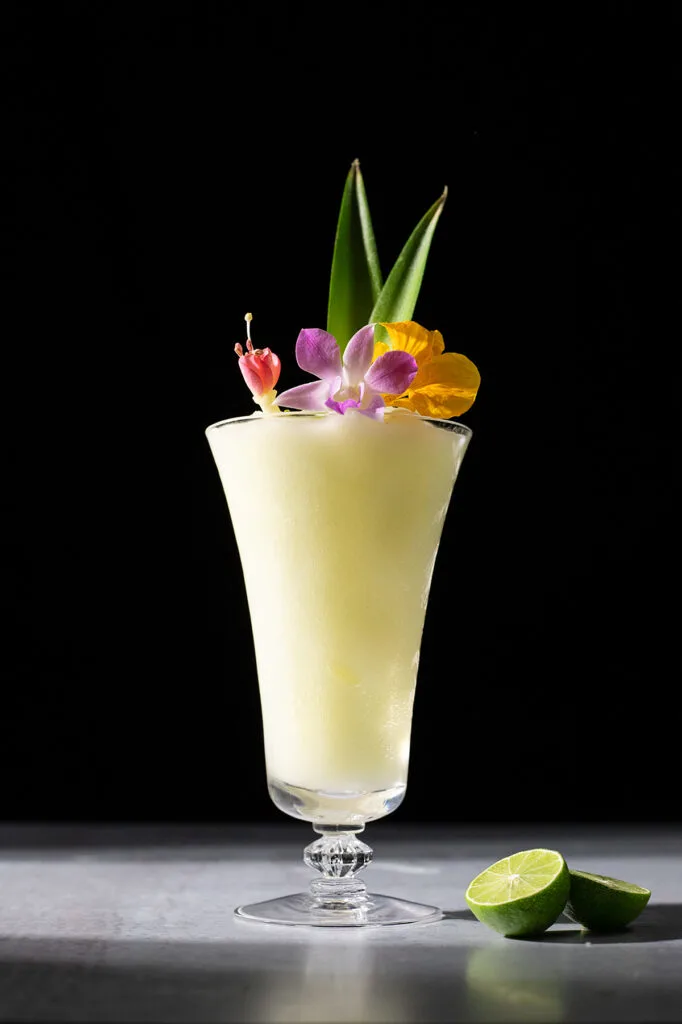 frozen blended white drink with edible flowers.
